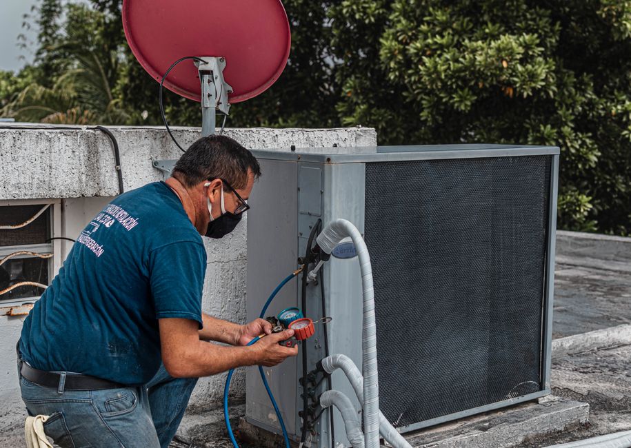 Seasonal maintenance check with a replacement filter and refrigerant gauge set